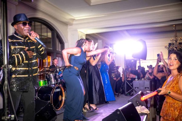 Live performance at Believe Ball with singers and musicians on stage.