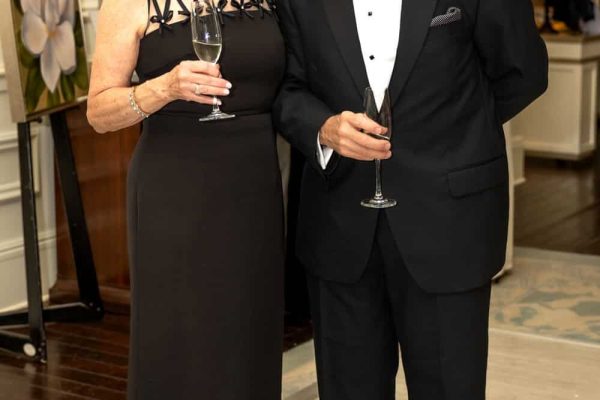 Elegant couple in formal attire at Believe Ball event in 2026.