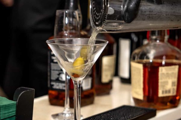 Bartender preparing a cocktail at Believe Ball event.