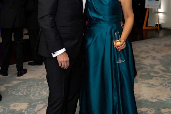Elegant couple at Believe Ball 2026 event in formal attire.