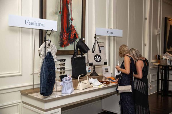 Fashion and men's accessories display at Believe Ball event.